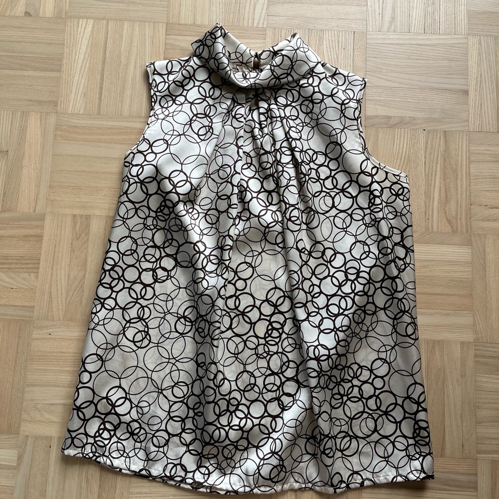 Fun ivory and brown party top with button up back. Size small.